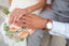 newly married couple hands touching