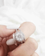 woman's finger with a ring on