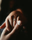 Person wearing a silver diamond ring