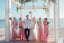 A group of bridesmaids with the bride and groom