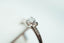 A close up of a ring with a prong setting